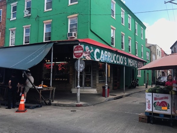 A Shop with a green awning at the Italian Market on 9th Street in Philly