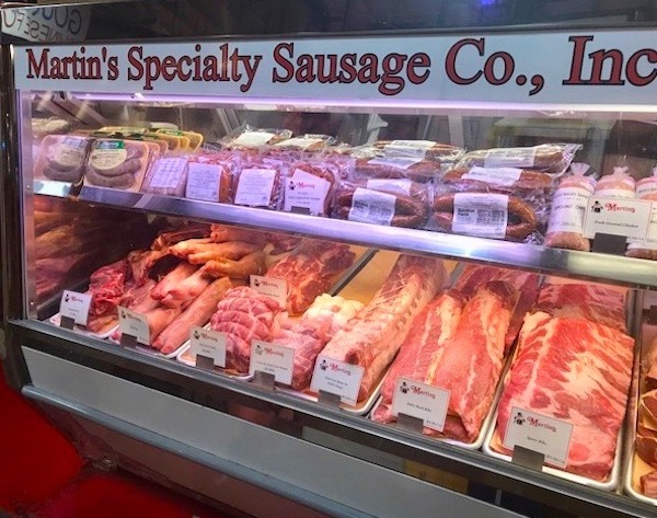 A refrigerated case filled with all sorts of meats