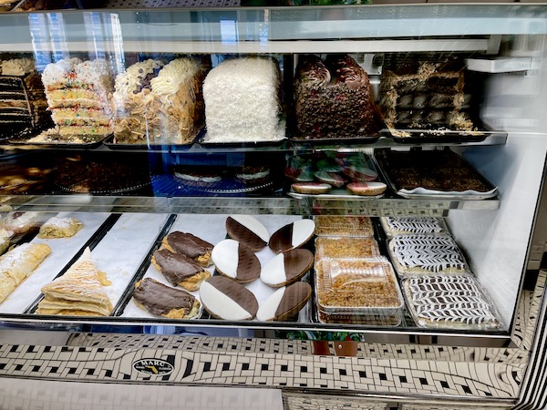 Pastry case filled with cakes and pastries in Philly