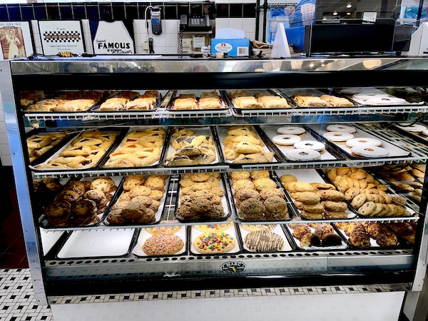 Pastry case filled with cookies and strudel at Famous Deli in Philly