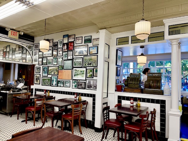 Inside an old deli with photos on the wall in Philly