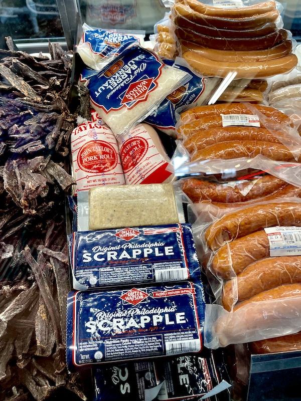 Case of various sausages for sale including scrapple at the Original Farmers Market L.A.