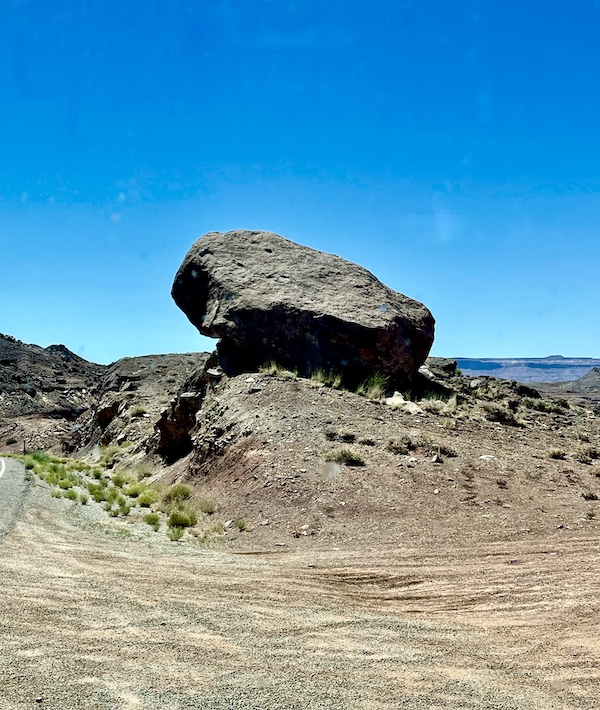 Slate gray boulder perched atop a mound at Spectacular Lake Powell Utah