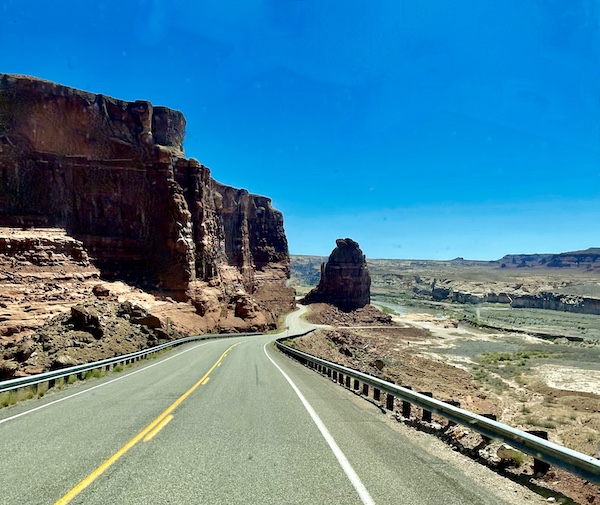 Highway through the mountains leaving Spectacular Lake Powell Utah