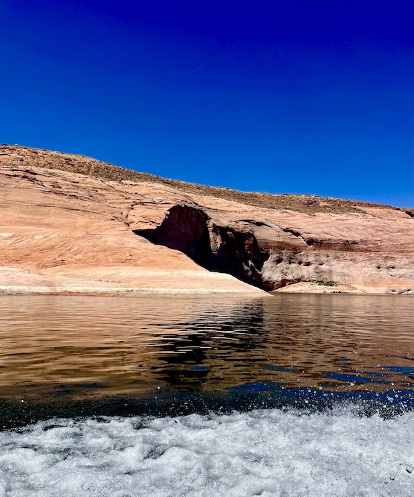 Rock formation with large cave in Spectacular Lake Powell Utah