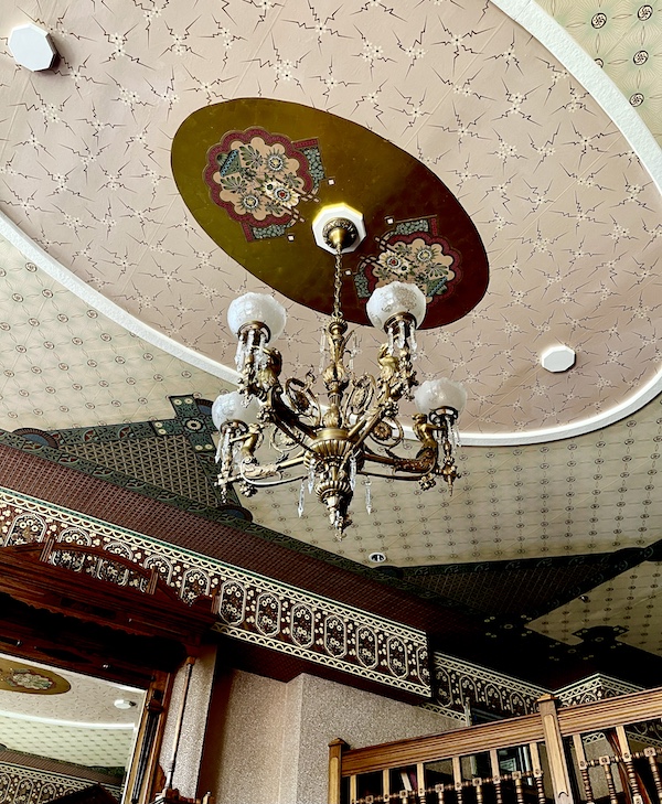 Ceiling at Strater Hotel Durango Colorado with chandelier and hand painted details