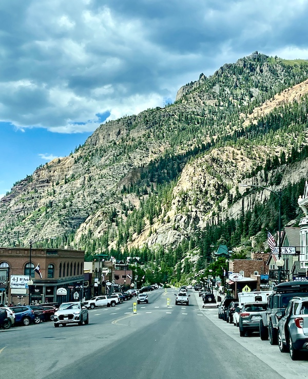 An old west looking town with mountains in the background on our Scenic Drive to Silverton and Ouray